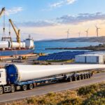 Wind turbine blade transportation in Australia with solar panels and wind farm